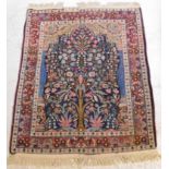 A Persian prayer rug with a tree of life