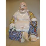 A mid 20thC porcelain figure of Buddha,