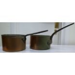 Two similar copper saucepans, having str