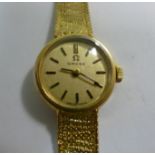 A lady's Omega 9ct gold, round cased wri