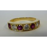 An 18ct gold seven stone ring, set with