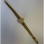 A lady's Tissot 9ct gold round cased wri