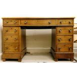 A late Victorian oak desk, having a gree