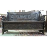A mid/late 19thC profusely carved oak se