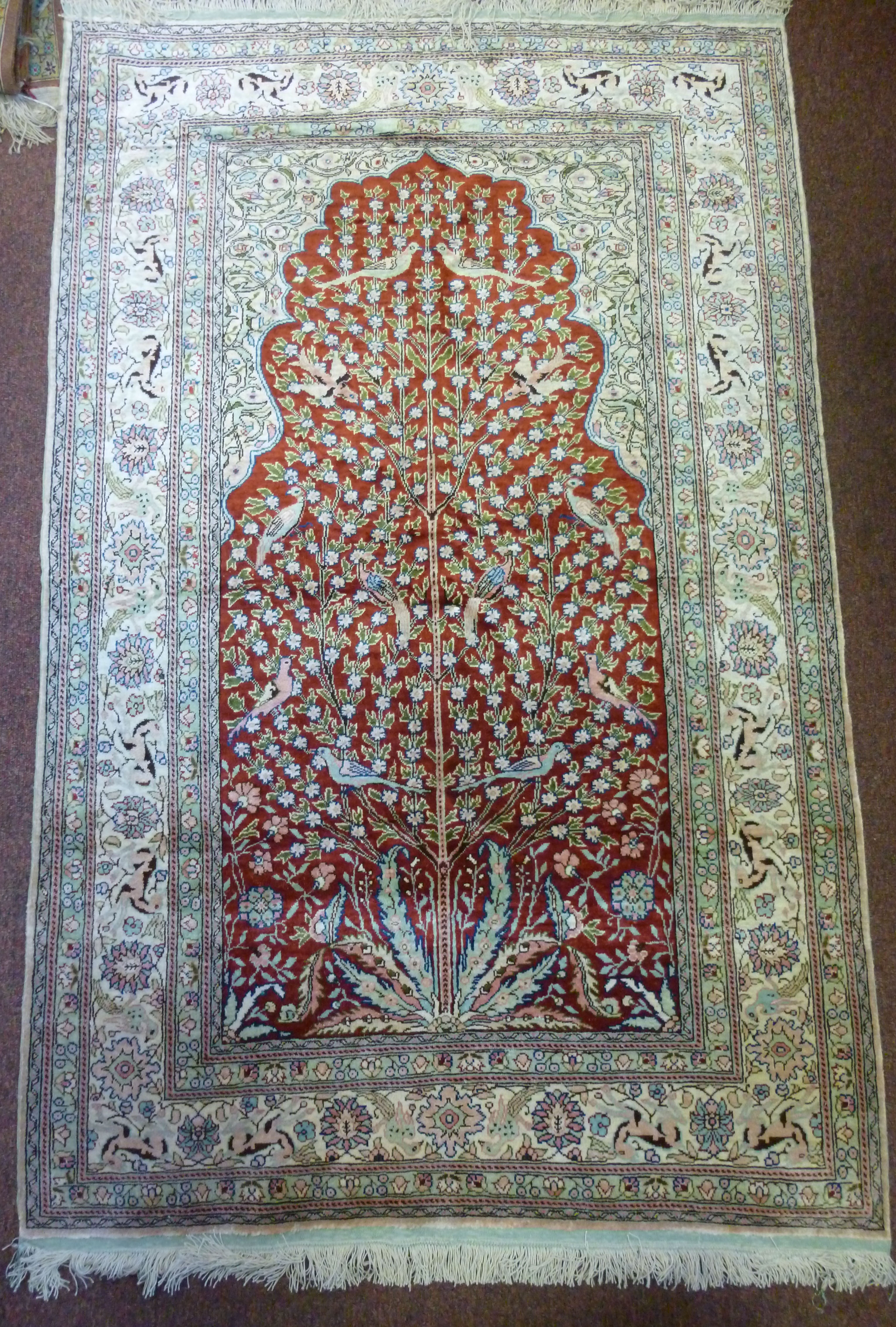 A Persian silk rug, the Tree of Life wit