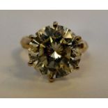 An 18ct gold claw set (6.5ct) diamond so