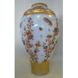 An early 20thC milk glass vase of tapere