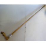 A late Victorian horn riding crop with a