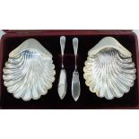 A pair of silver scallop shell design bu