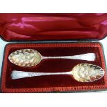 A matched pair of silver berry spoons wi