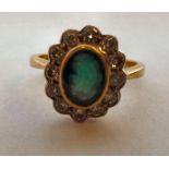 An 18ct gold ring, set with an emerald,