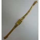 A lady's gold coloured metal cased brace