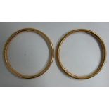 A pair of 9ct gold hollow ring bangles