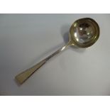 A George III silver sauce ladle, having