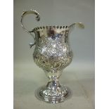 A George III silver cream jug, having a