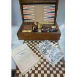 An early 20thC mahogany games compendium