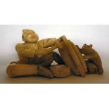 An early 20thC Japanese carved ivory fig