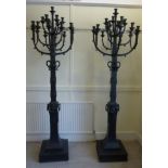 A pair of modern, freestanding, black pa