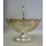 A silver sugar basket of panelled, oval