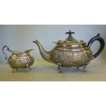 A late Victorian silver teapot of oval o