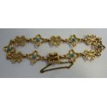 A gold coloured metal and turquoise set,