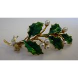 An 18ct gold, enamelled green and white
