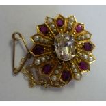 A gold coloured metal pendant/brooch, cl