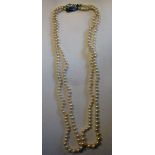 A two row graduated pearl necklace, on a