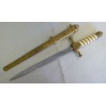 A German Imperial Dirk, having a gilt brass pommel and quillions with a ribbed ivory handle the (