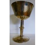 A modern silver coloured metal chalice,