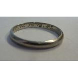 A white metal wedding ring