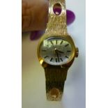 A lady's Delvina Incabloc yellow metal,