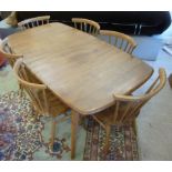 An Ercol elm and beech Windsor dining ta