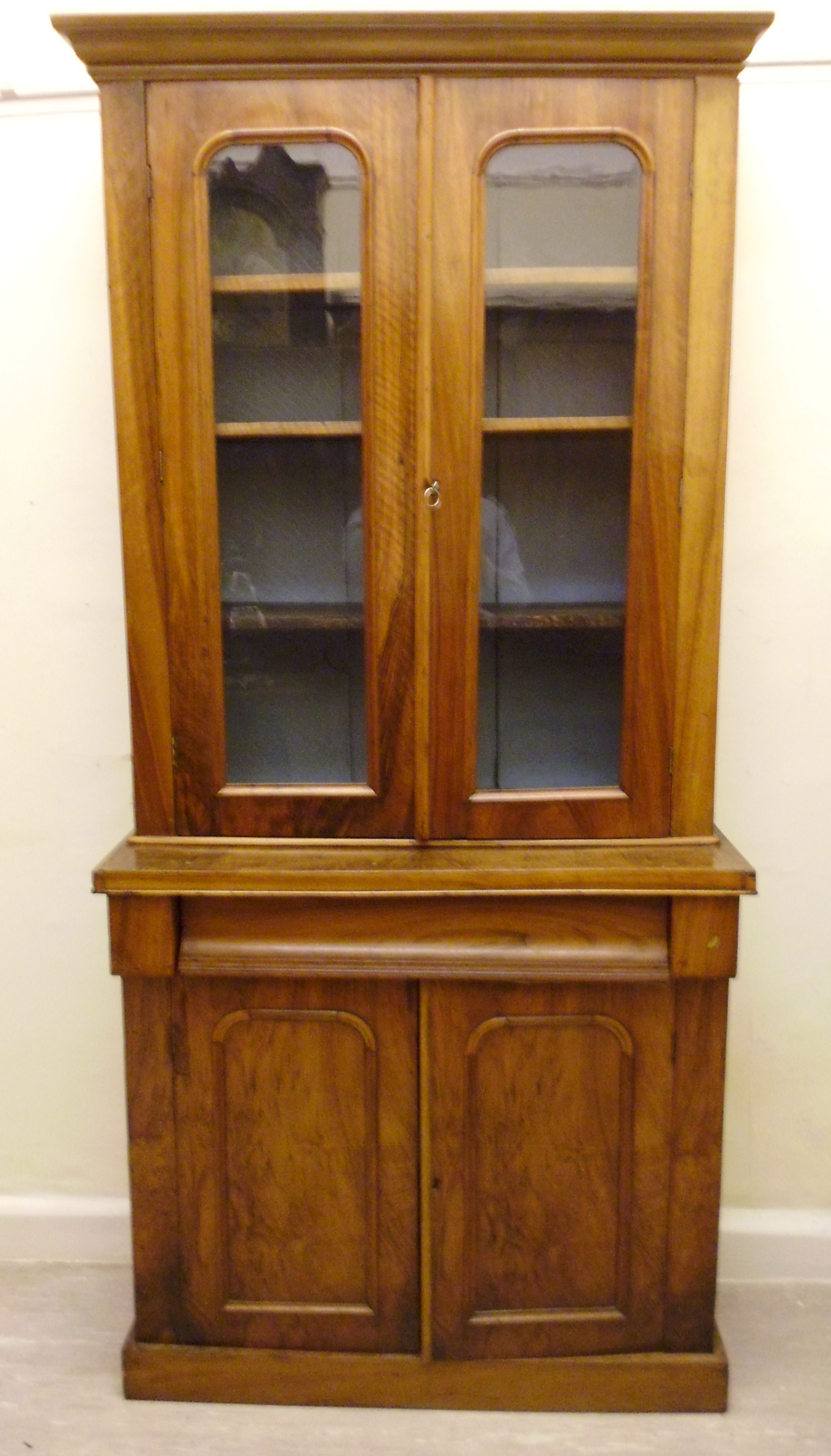 A late Victorian walnut cabinet bookcase