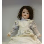 A mid 20thC German bisque head doll, hav