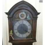 A 1920s oak longcase clock, the hood hav