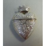 An early 20thC silver pill box of heart