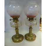 A pair of late Victorian brass oil lamps