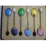 A set of six silver coffee spoons with a