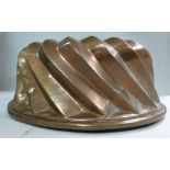 A late Victorian doughnut shaped copper