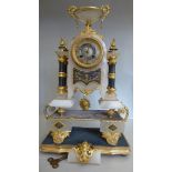 A late 19thC onyx cased mantel clock wit