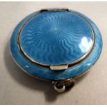 A 1920s silver powder compact, decorated