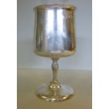 A silver goblet, on a pedestal foot  Coo