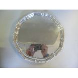 A silver salver, having a cast gadrooned