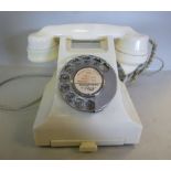 A vintage white Bakelite cased telephone