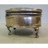 A silver oval ring box, the hinged lid s