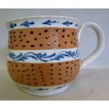 A late 18thC earthenware cup, having a d