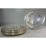 A set of eleven silver coloured metal, b