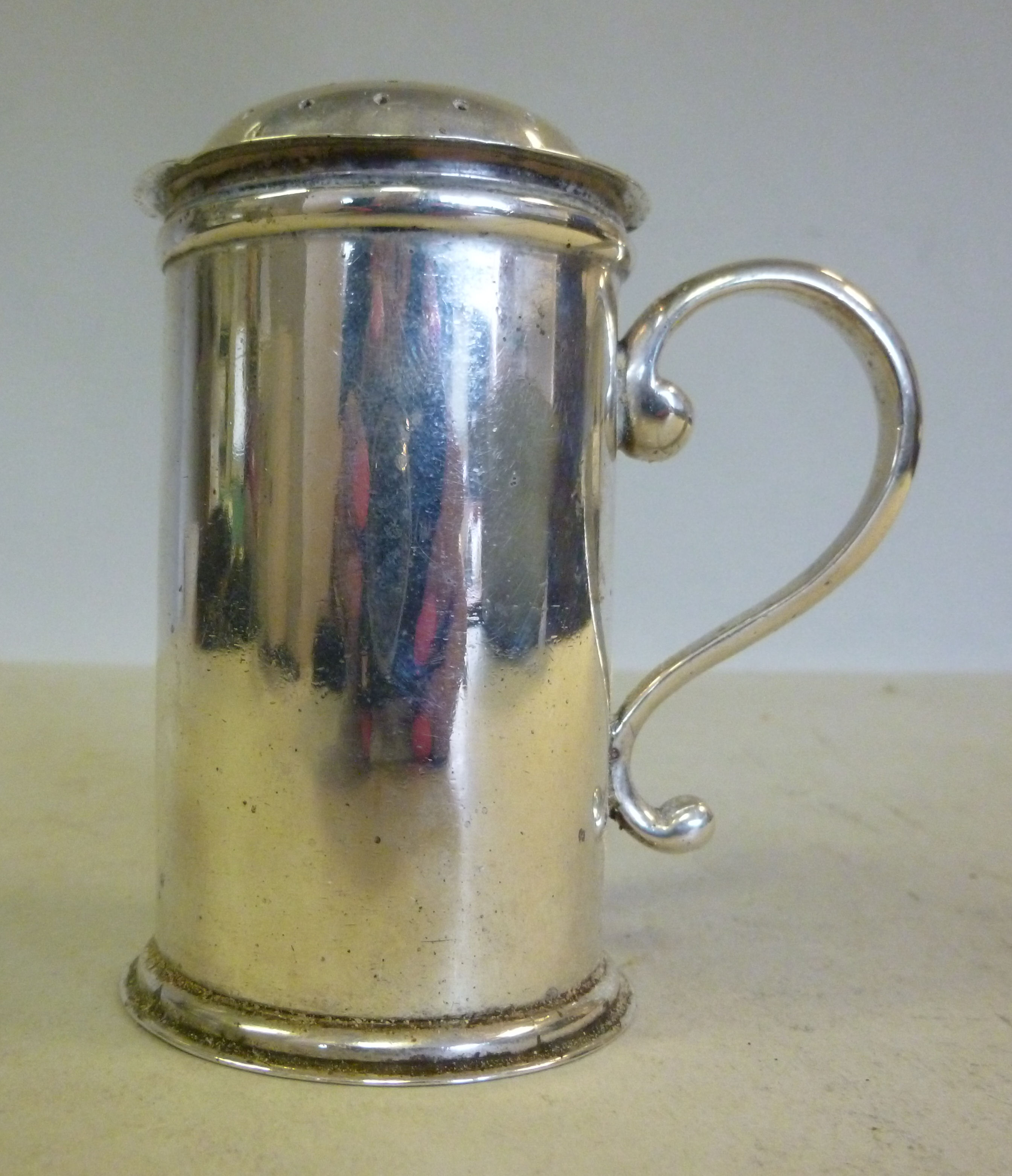 A Georgian style silver caster of cylind