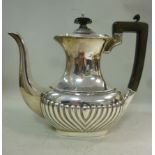 A bachelor's silver coffee pot, of oval,